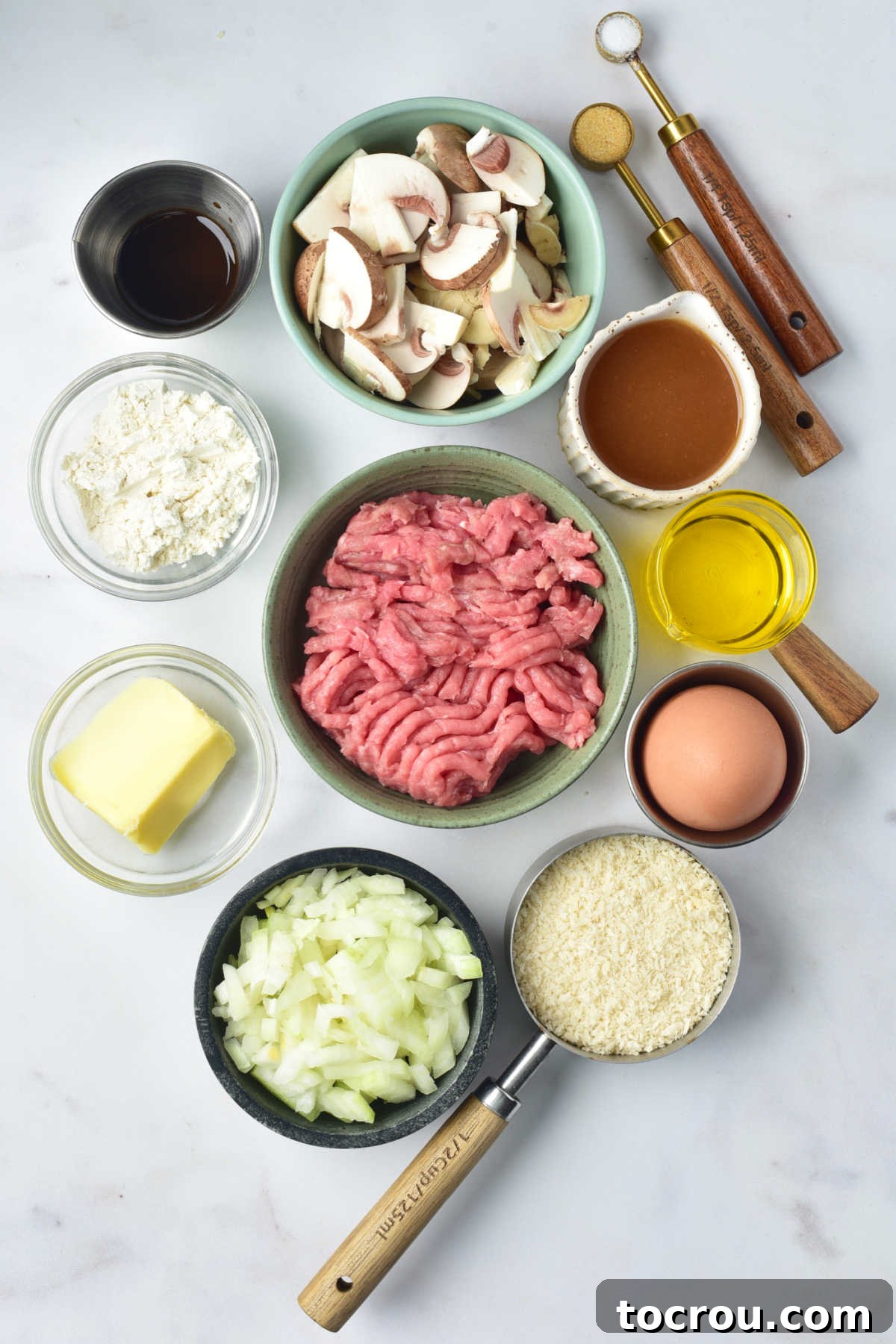 Turkey Salisbury Steaks Ingredients Ingredients including ground turkey, mushrooms, onions, breadcrumbs, beef broth, butter, flour, etc ready to be made into ground turkey salisbury steaks.