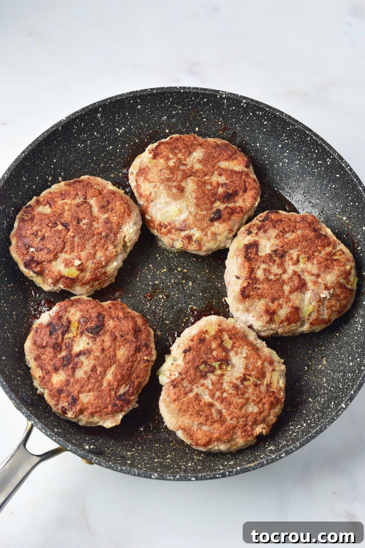 Browning Turkey Patties Browned turkey patties in skillet, ready for the gravy.