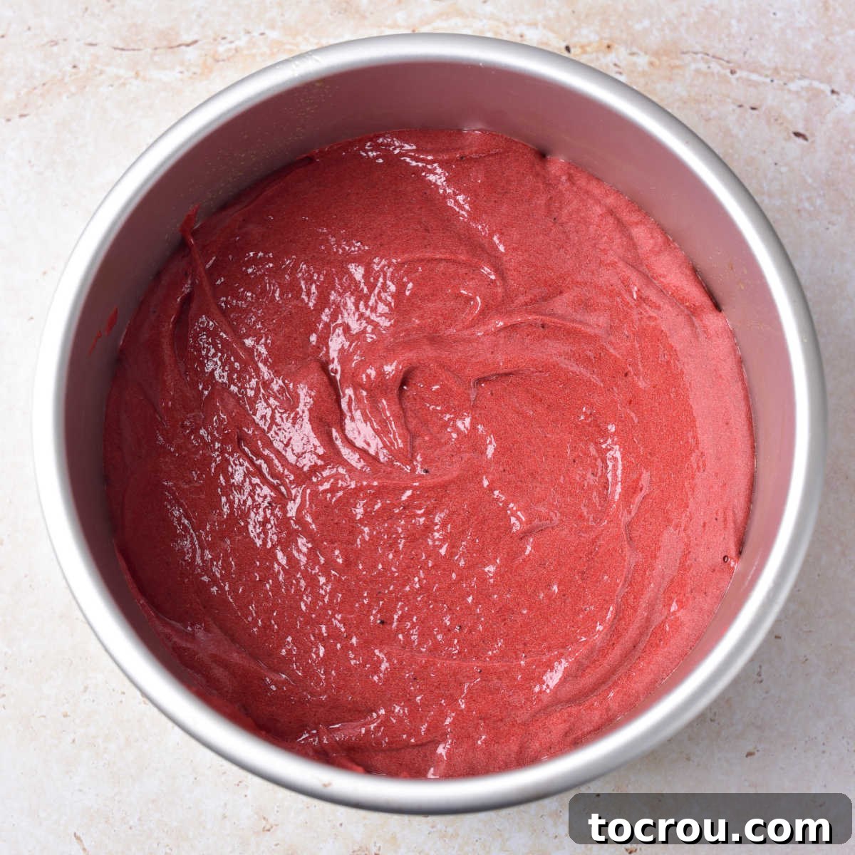 Red Velvet Cake Batter in Pan, Ready for Oven Thick red velvet cake batter in round cake pan, ready to bake.