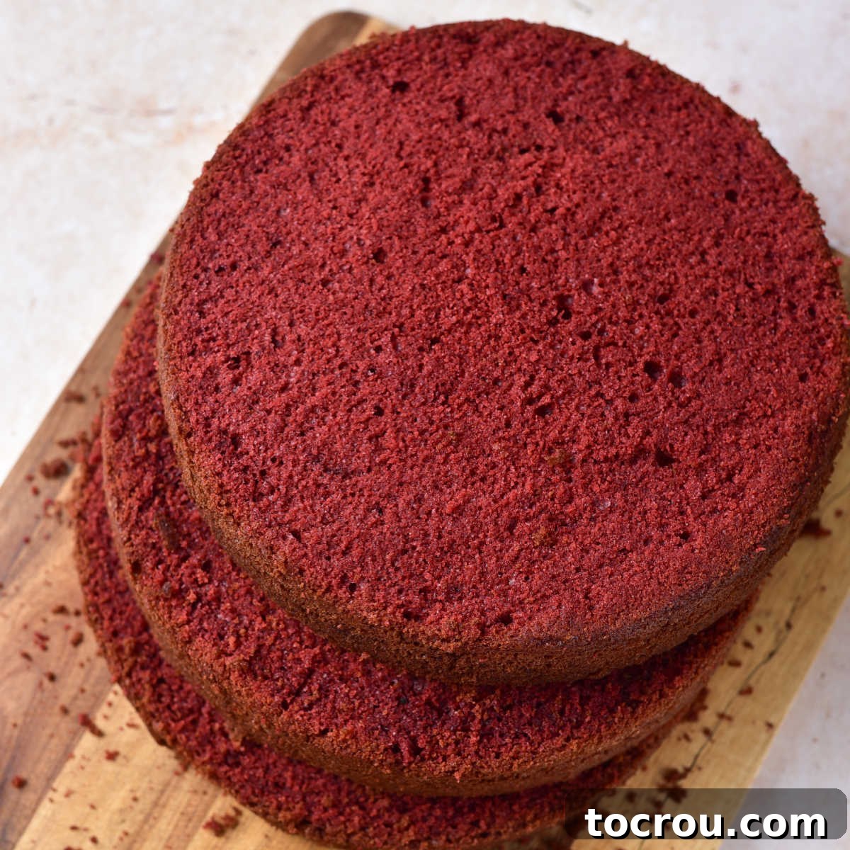 Trimmed Red Velvet Cake Layers Ready for Frosting Red velvet cakes with the domes trimmed off, ready to be decorated.