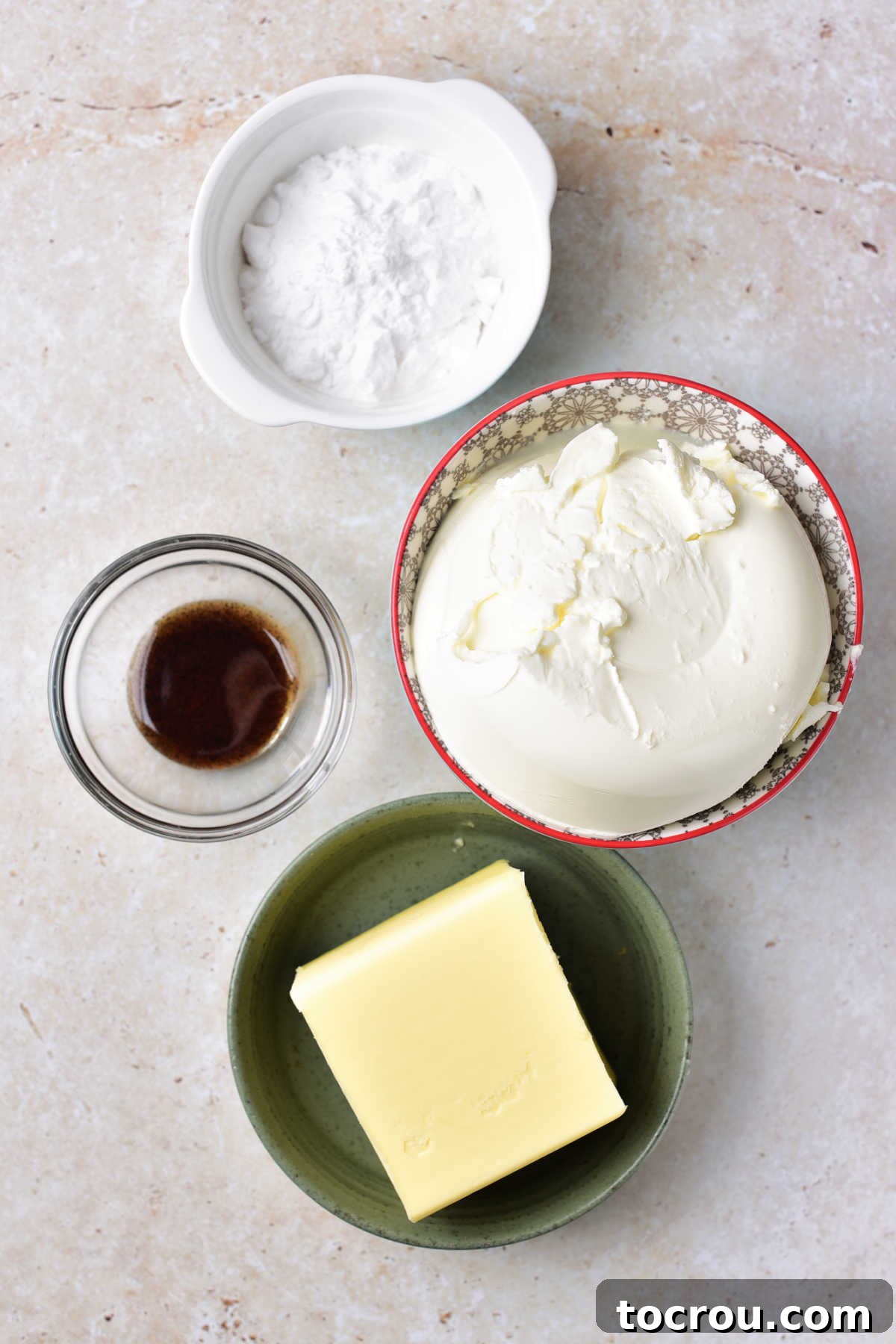 Velvet Mascarpone Frosting 3 Ingredients including mascarpone cheese, butter, vanilla, and powdered sugar ready to be made into mascarpone frosting.