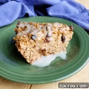 A close-up of a delectable piece of MiMi's Oatmeal Raisin Cookie Baked Oatmeal, moist and rich, ready for a taste.