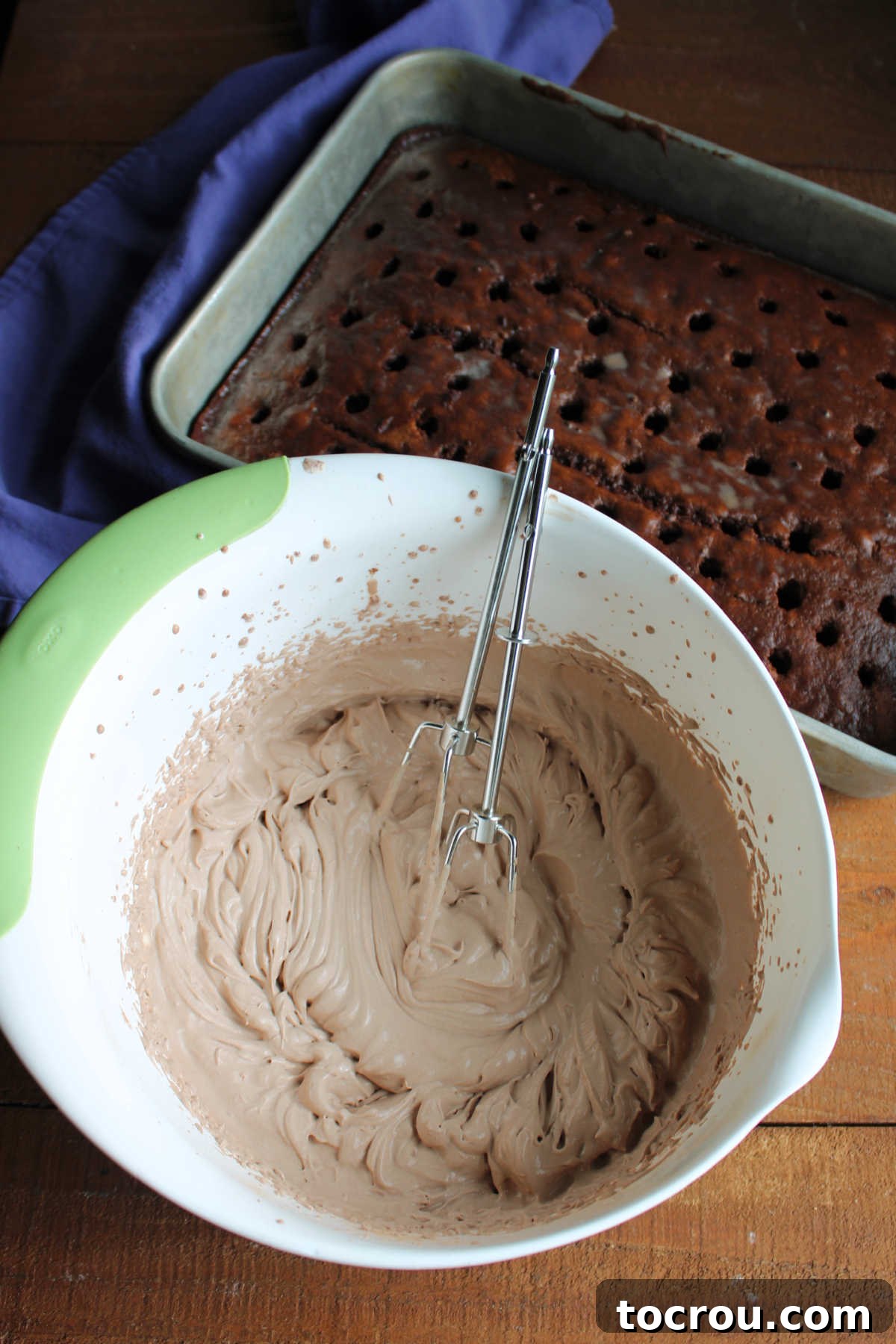 Triple-Milk Chocolate Dream 4 Bowl of chocolate whipped cream next to pan of milk soaked chocolate cake.