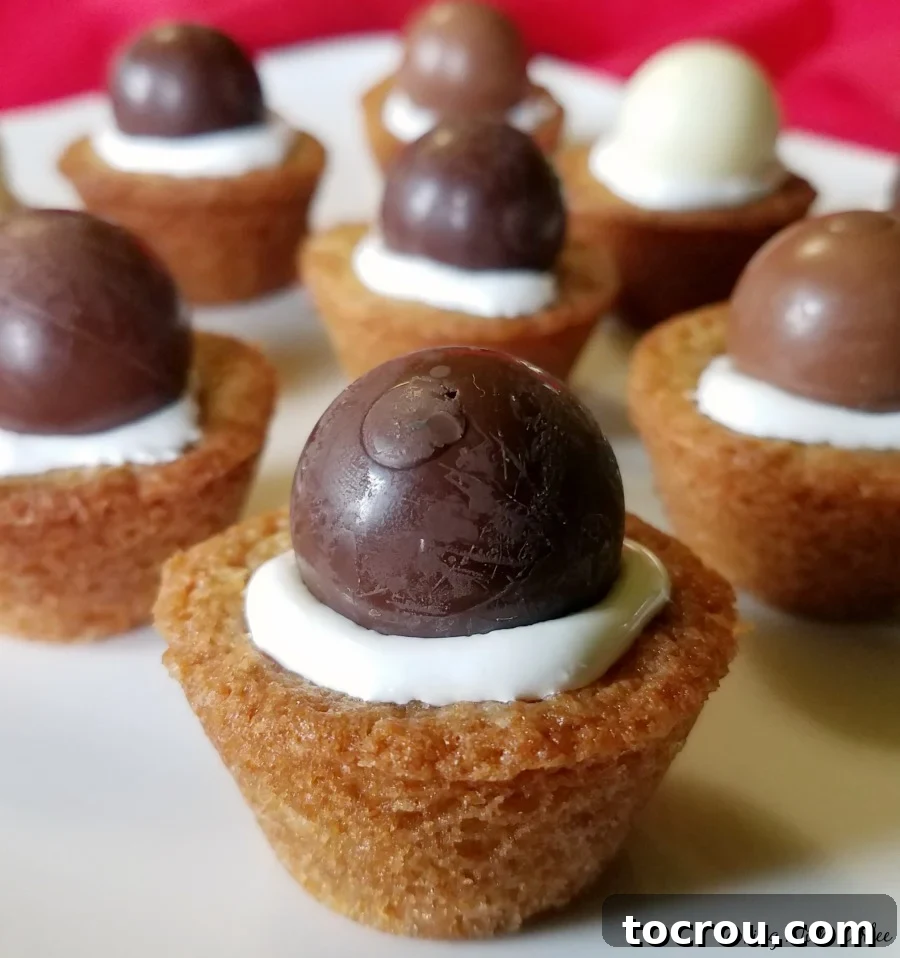 Plate of cookie cups stuffed with marshmallow fluff and chocolates.