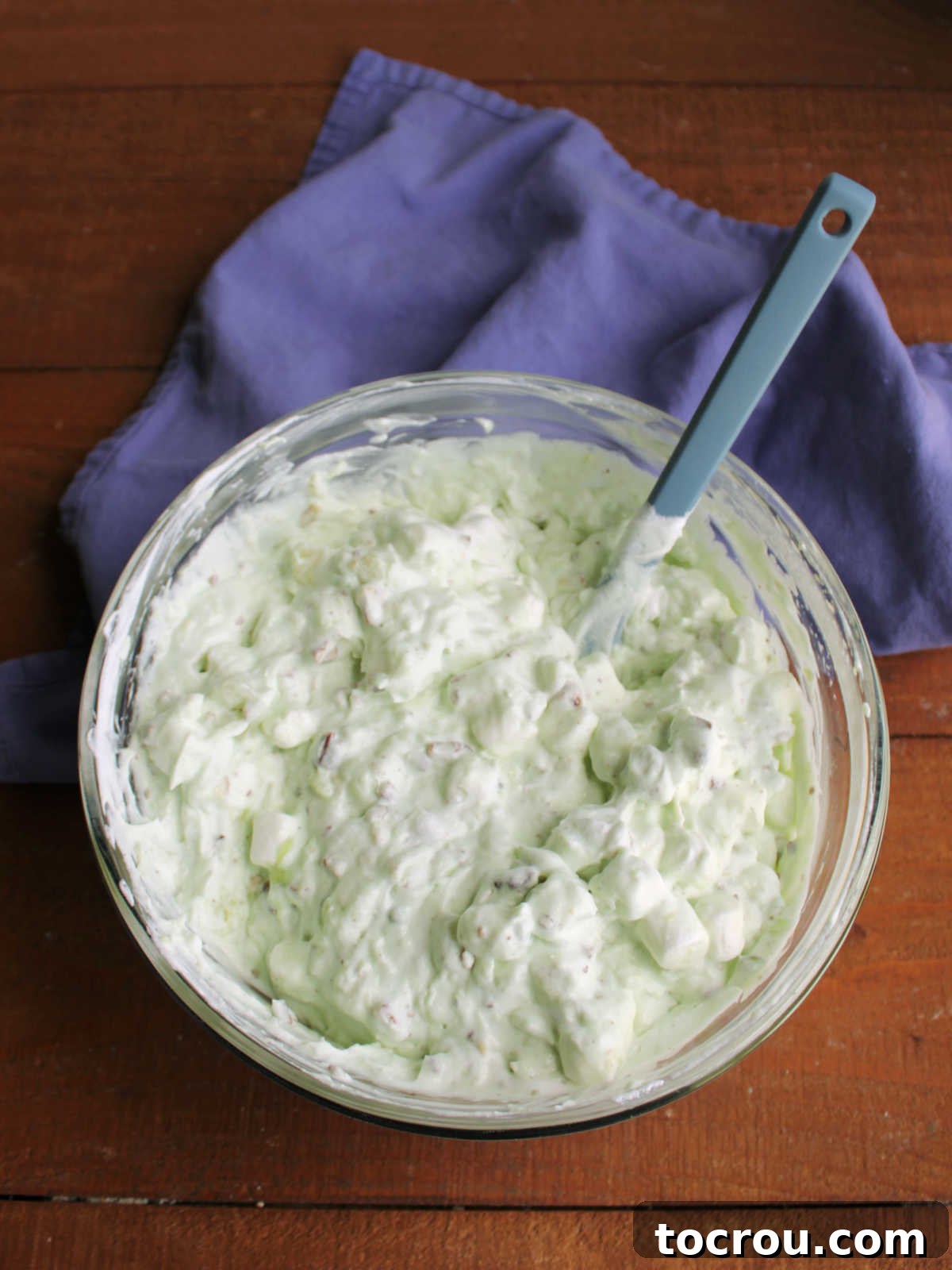 Mixing bowl of watergate salad mixture ready to go in the fridge to chill.