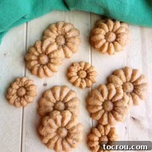 Flower shaped cheese crackers with flecks of chili powder baked inside, ready to eat.