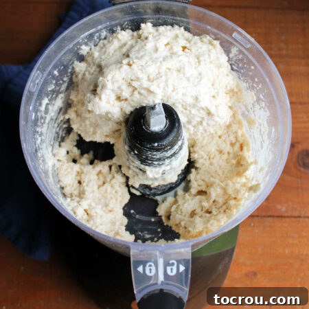 Perfectly Sweet Shortcake Biscuits 7 Food processor with sweet biscuit dough inside.