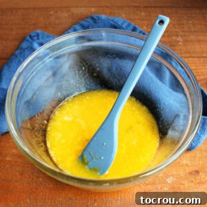 Bowl with beaten eggs, oil, and sugar ready for the sourdough starter.