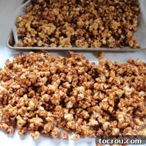 snickers popcorn cooling on wax paper.