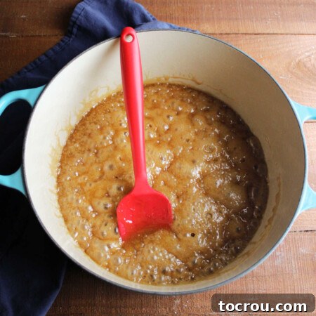 Dutch oven with boiled brown sugar caramel mixture.