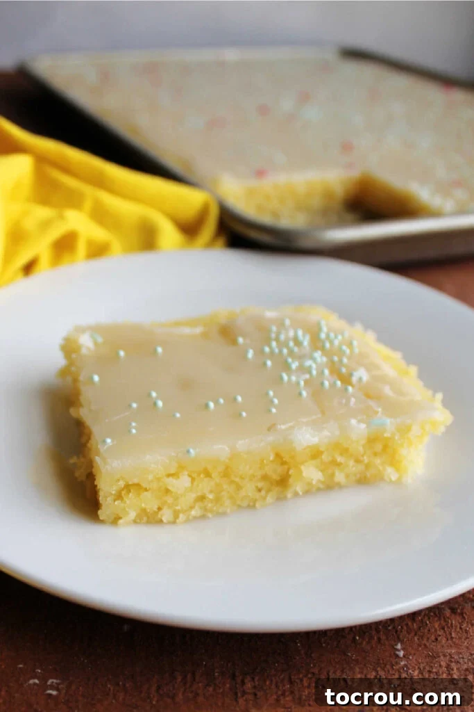 Golden Lemon Crowd Pleaser 2 Piece of lemon Texas sheet cake with glossy icing and spinkles on top.