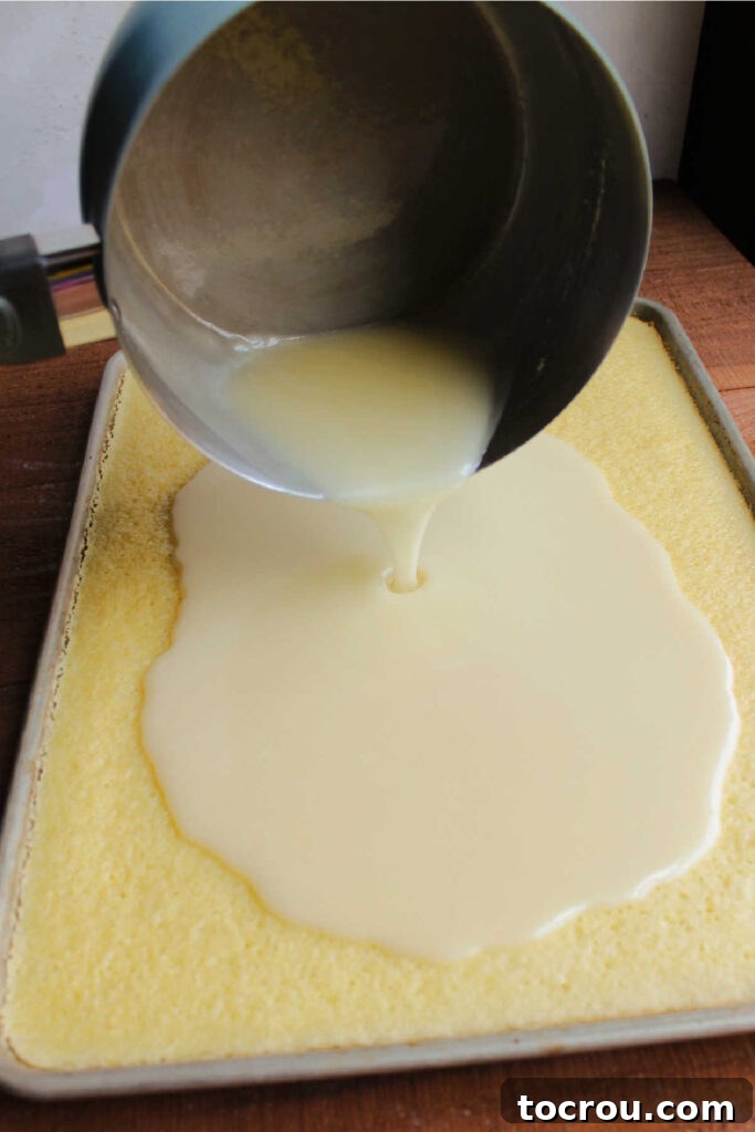 Golden Lemon Crowd Pleaser 5 Pouring lemon icing over sheet cake.