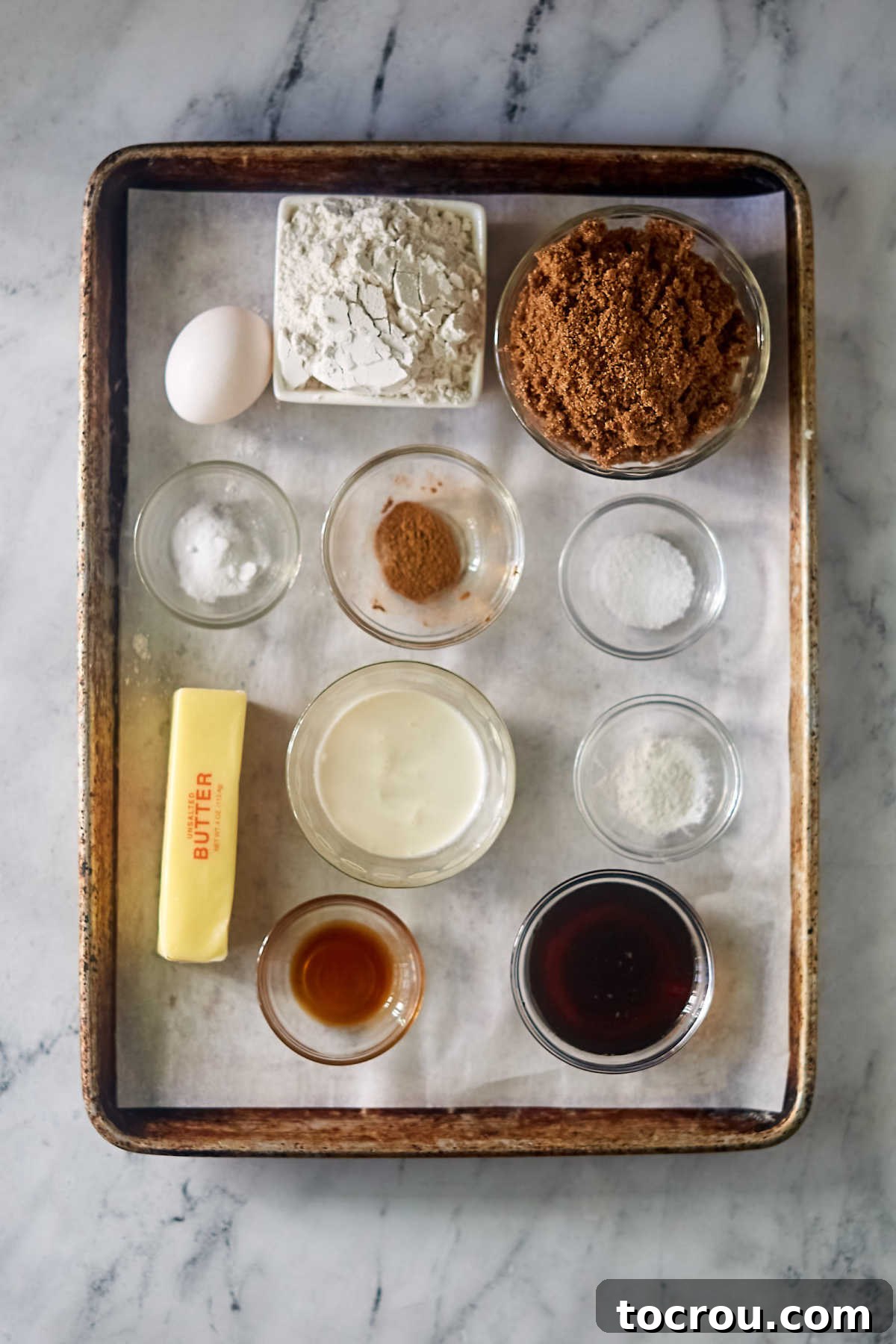 Maple Cinnamon Cookie Ingredients Ingredients including butter, brown sugar, flour, cinnamon, maple syrup, vanilla, egg, cinnamon etc. ready to be made into chew maple cinnamon cookies.