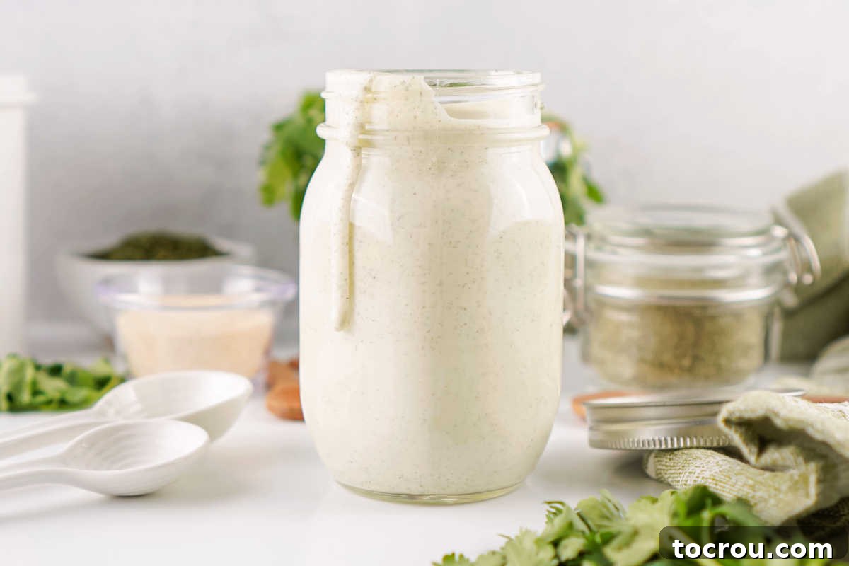 Jar of homemade ranch dressing made from homemade ranch seasoning mix. 