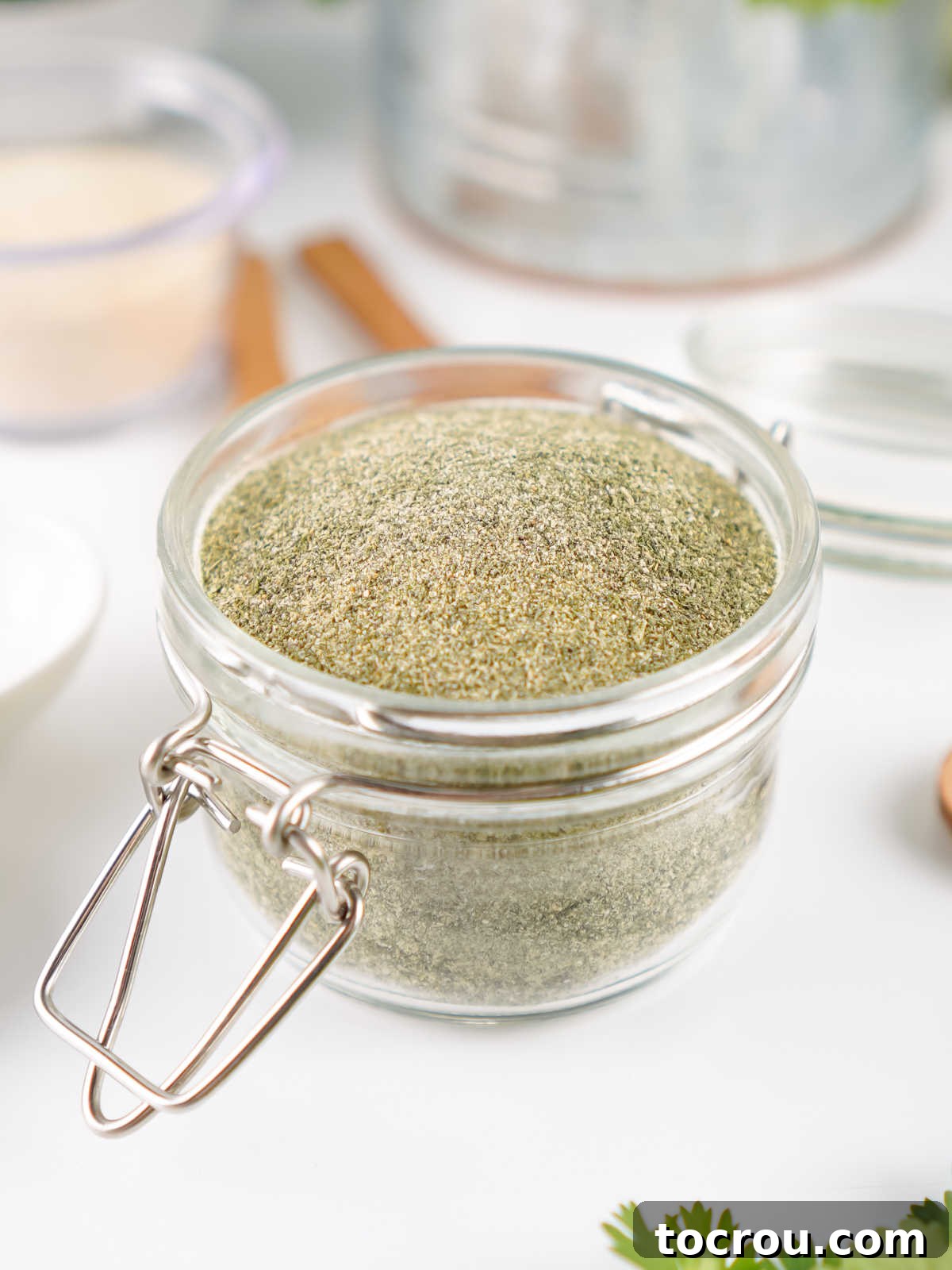 Jar of homemade ranch seasoning after the seasonings have been mixed in a spice grinder to make a fine powder. 