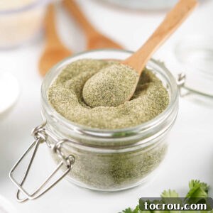 Small glass jar filled with homemade ranch seasoning ready to be used in other recipes.