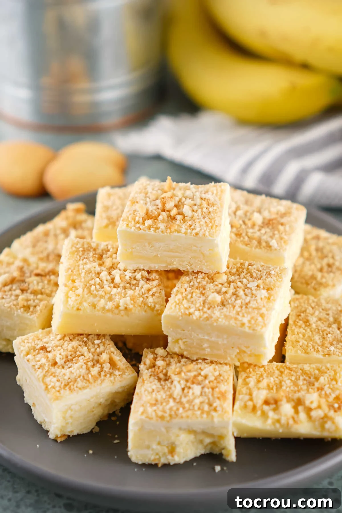 Homemade Banana Pudding Fudge Squares of banana pudding fudge on plate, ready to eat.