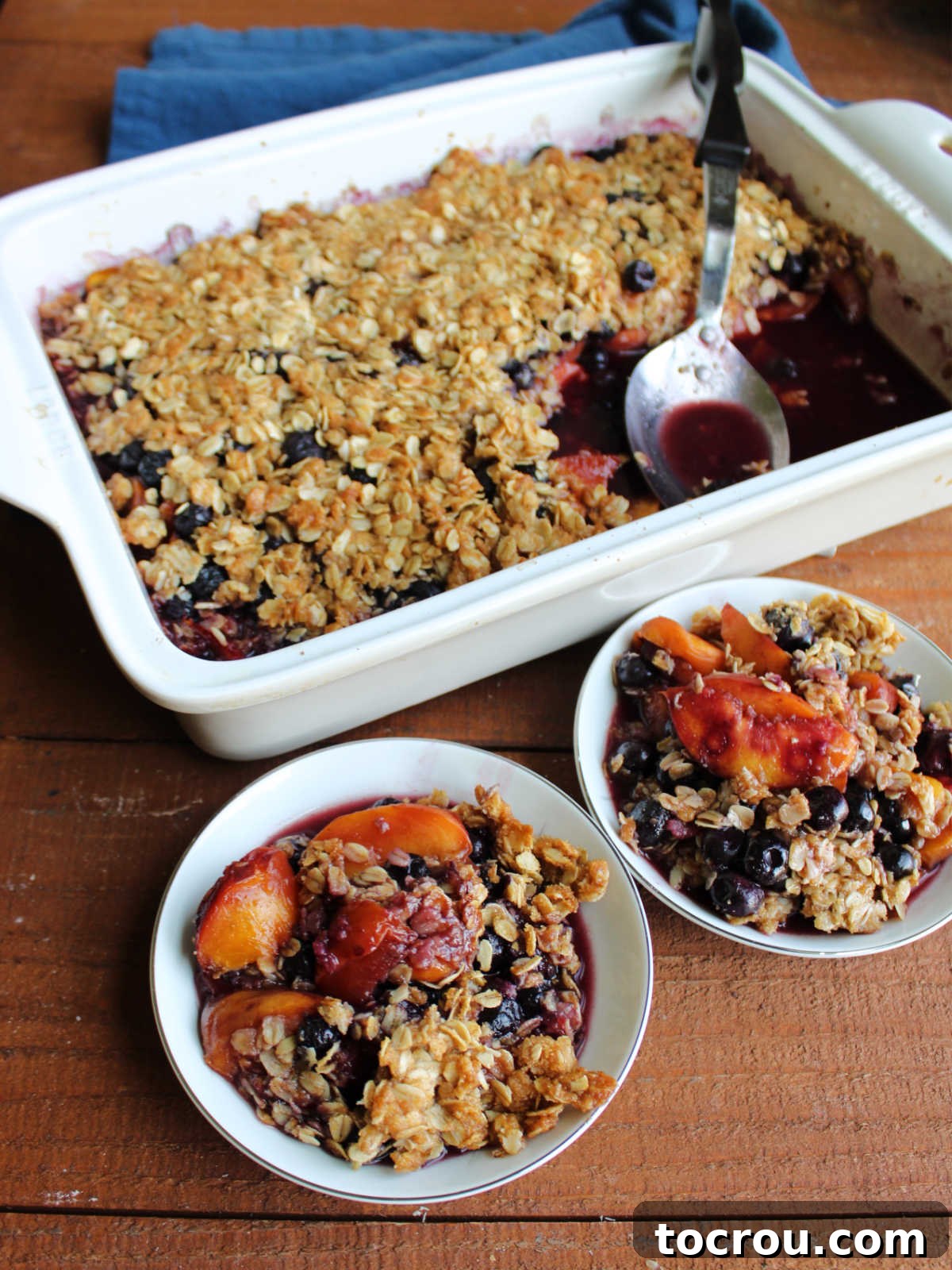 Serving Warm Peach Blueberry Crisp Serving up helpings of warm peach blueberry crisp.
