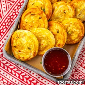 Golden brown crab rangoon pinwheels with puff pastry crust served with sweet chili dipping sauce.