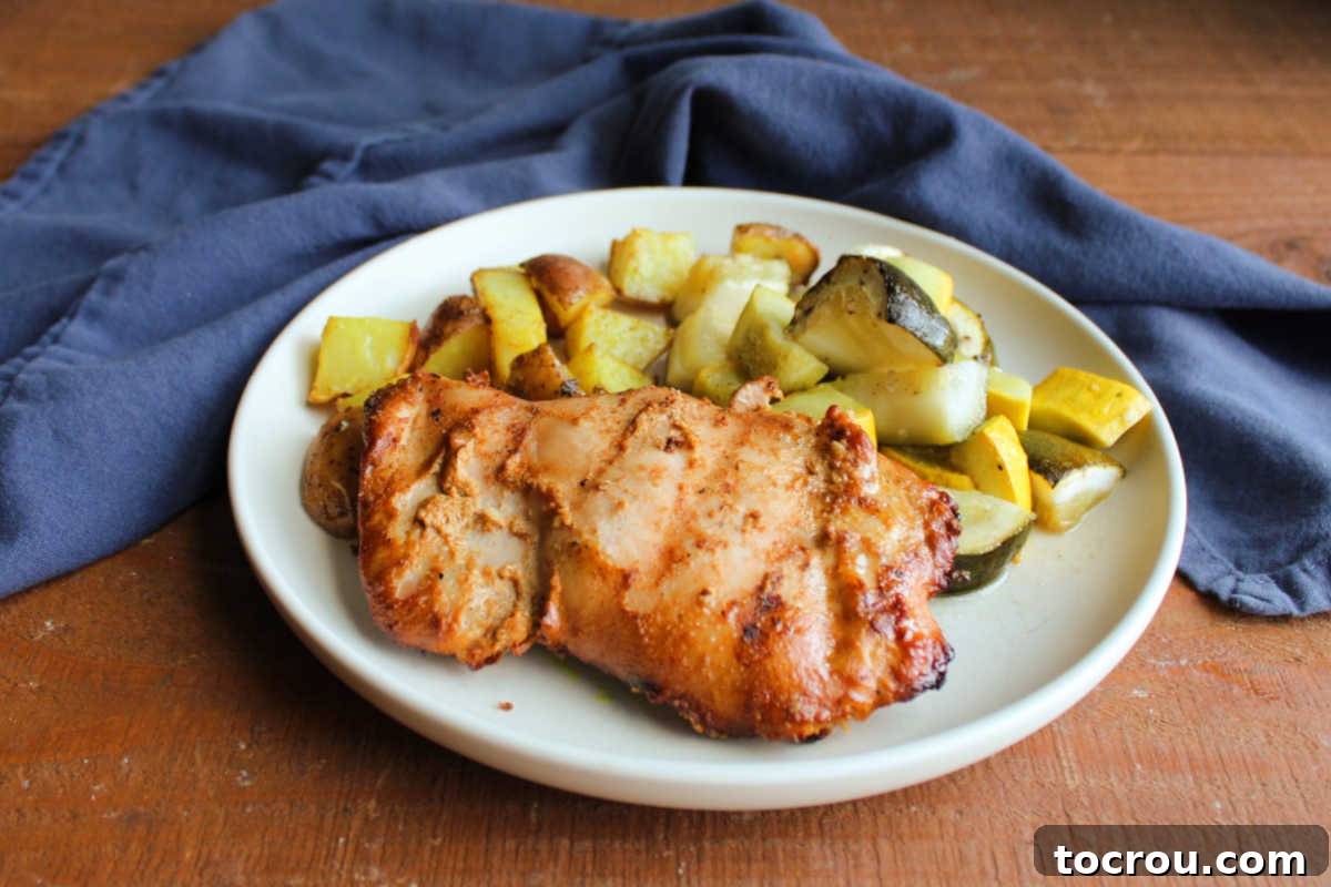 Smoked tandoori chicken with roasted curry potatoes and zucchini and summer squash. 