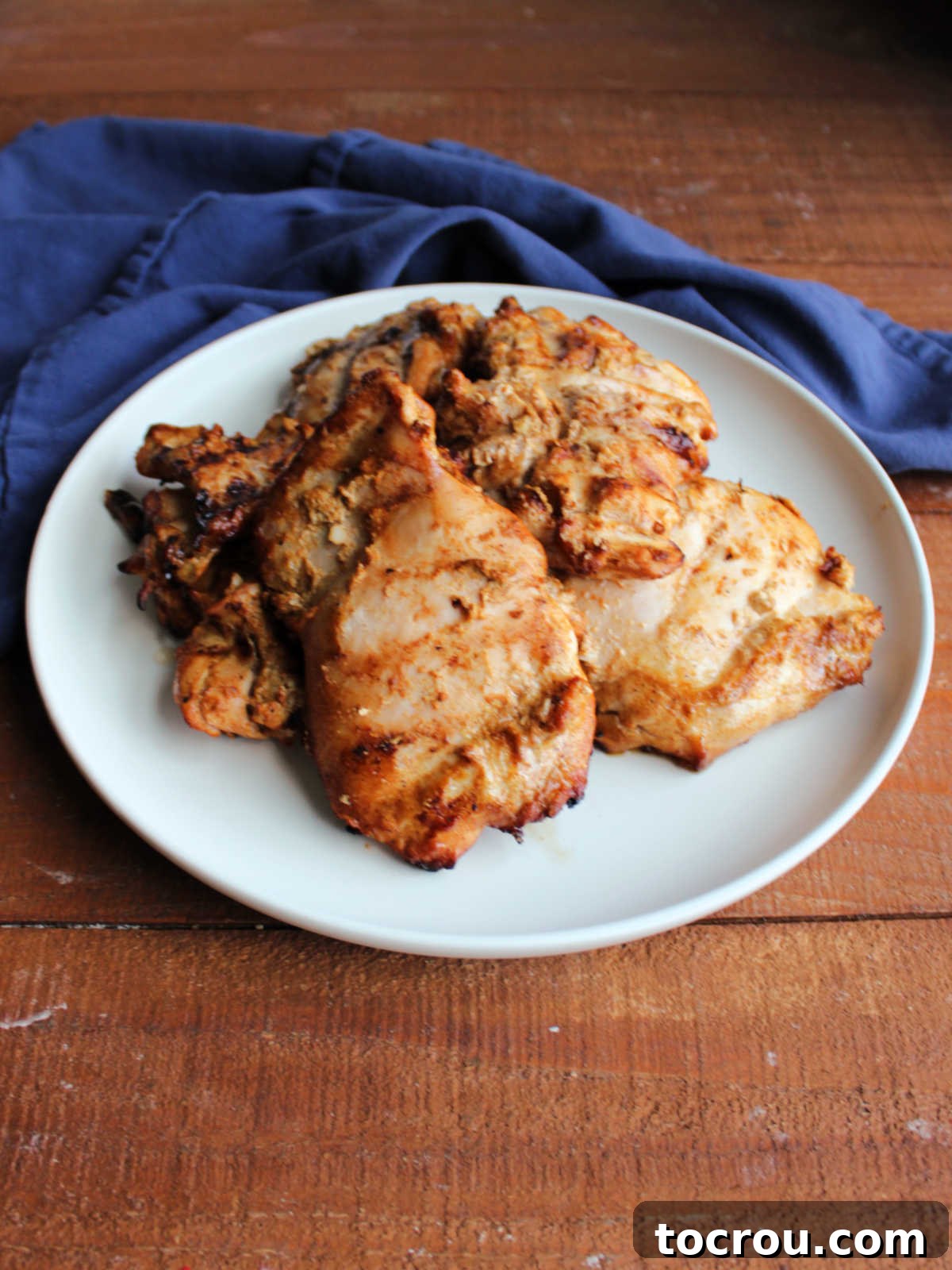 Plate of grilled tandoori chicken ready to be served. 