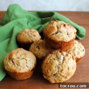 A tempting pile of golden oatmeal raisin sourdough muffins, ready to be enjoyed as a hearty and flavorful breakfast treat.