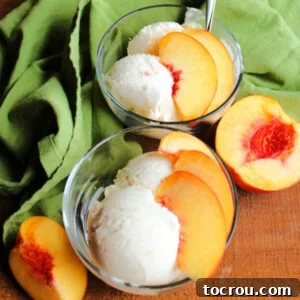 Dishes of homemade peach ice cream with slices of fresh peach on top.