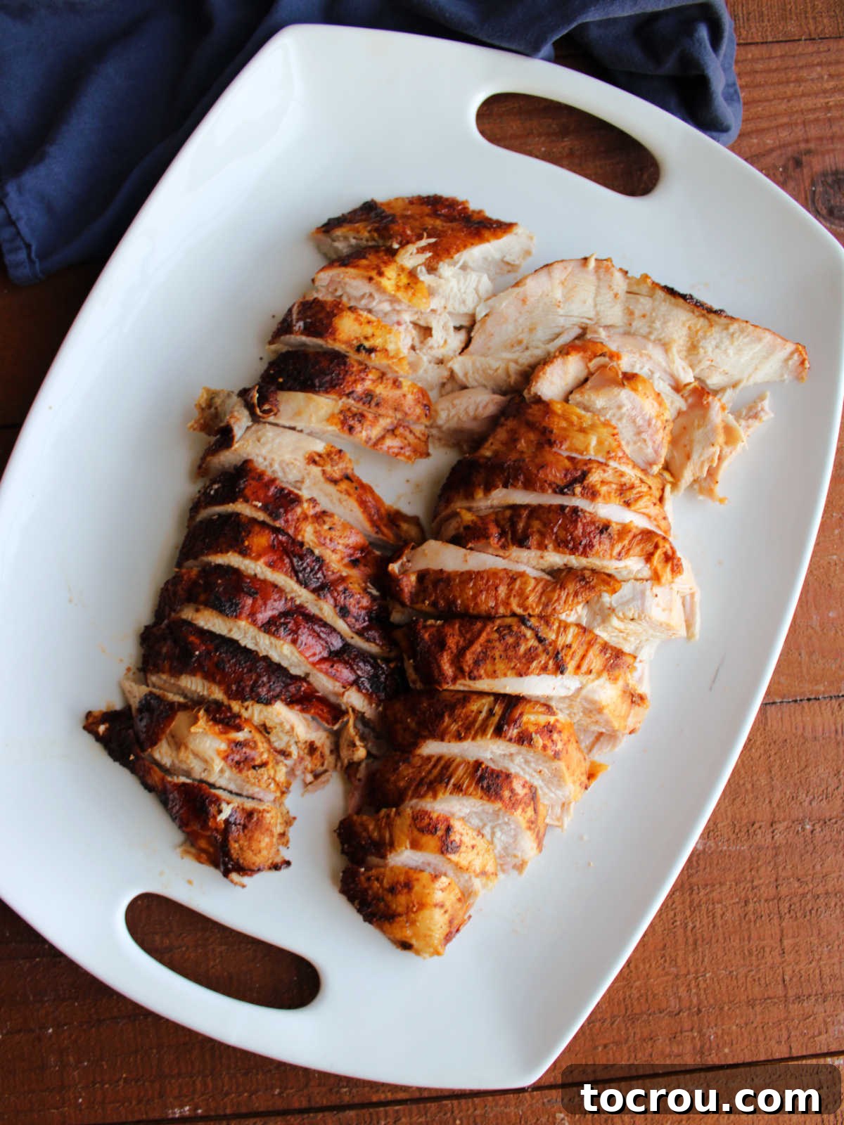 Platter of smoked turkey breast slices, ready to eat.