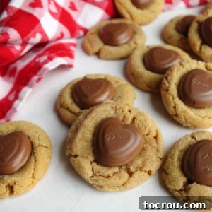 Close up of soft chewy peanut butter blossoms with Dove chocolate heart candies for Valentine's Day.
