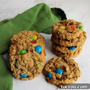 Stack of peanut butter monster cookies with oatmeal, chocolate chips and m&ms.