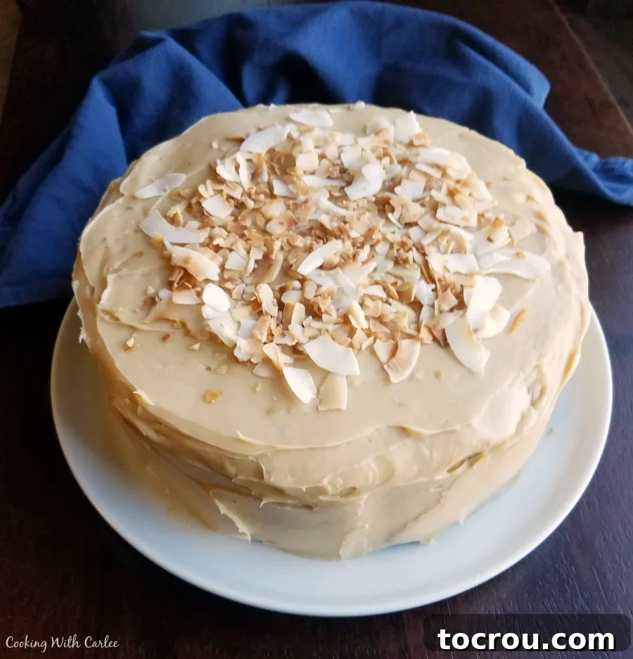 Layer Cake with Caramel Frosting and Toasted Coconut layer cake with sweetened condensed milk frosting topped with toasted coconut