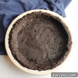 No bake Oreo pie crust in pie plate, ready for filling.