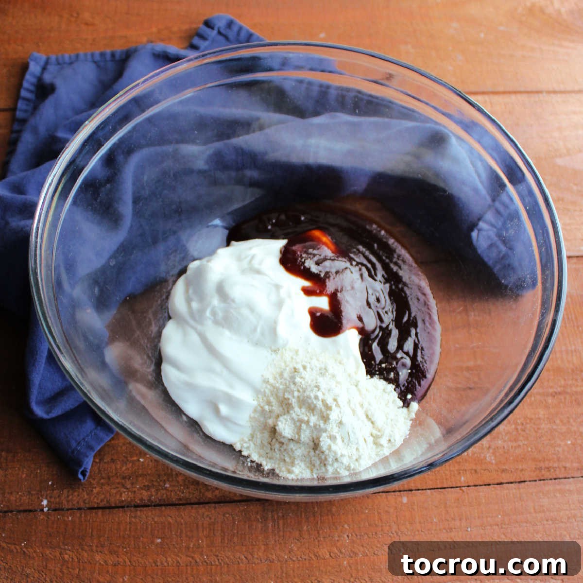 Dressing ingredients for BBQ Ranch Pasta Salad Sour cream, bbq sauce and ranch dressing mix ready to be made into pasta salad dressing.