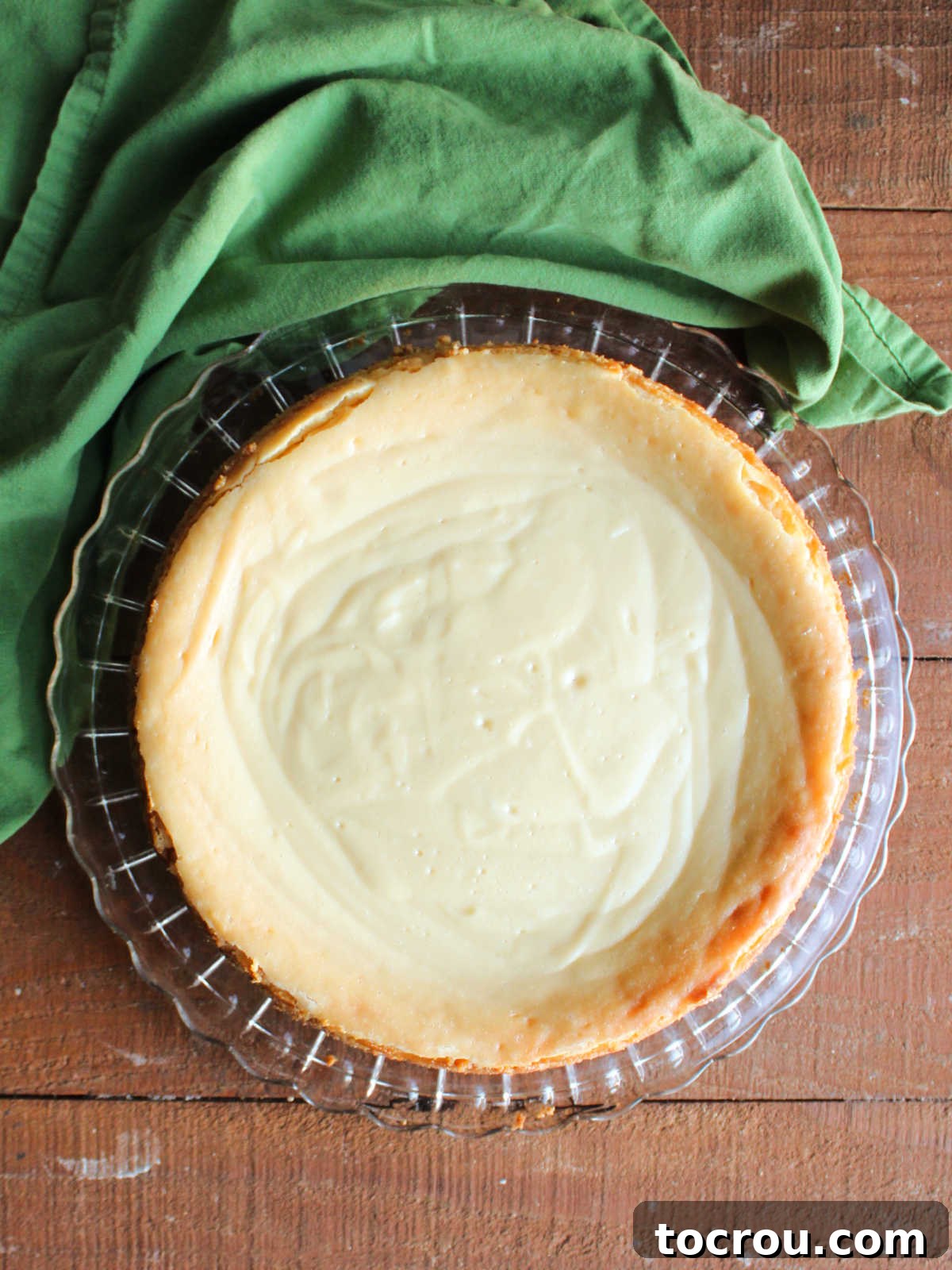 Freshly Baked Key Lime Cheesecake A stunning whole baked Key Lime Cheesecake, perfectly golden and ready to be chilled before serving.