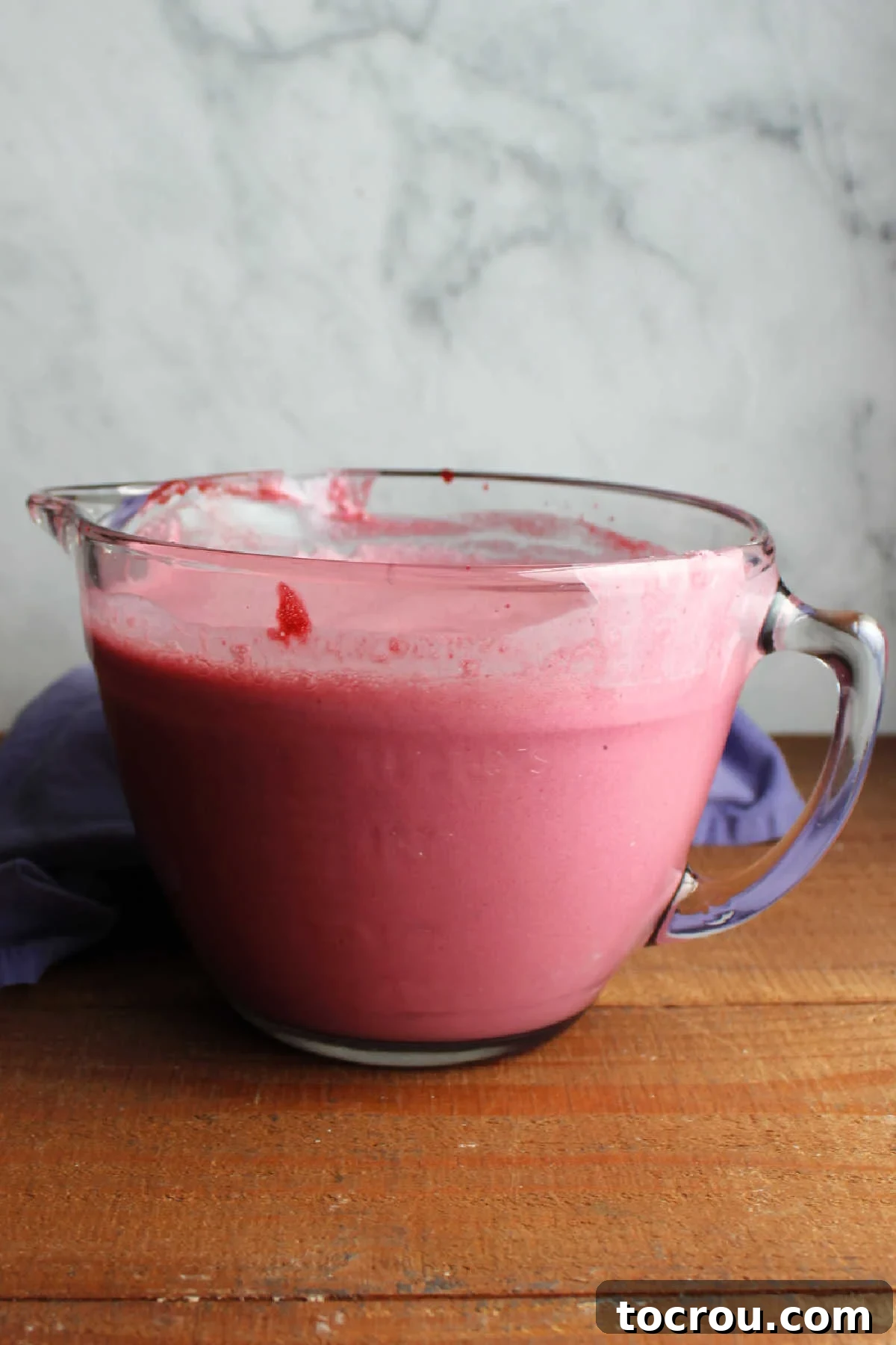 Midnight Berry Indulgence 8 Blackberry juice mixed into cream and half and half in large glass batter bowl, ready to be churned.