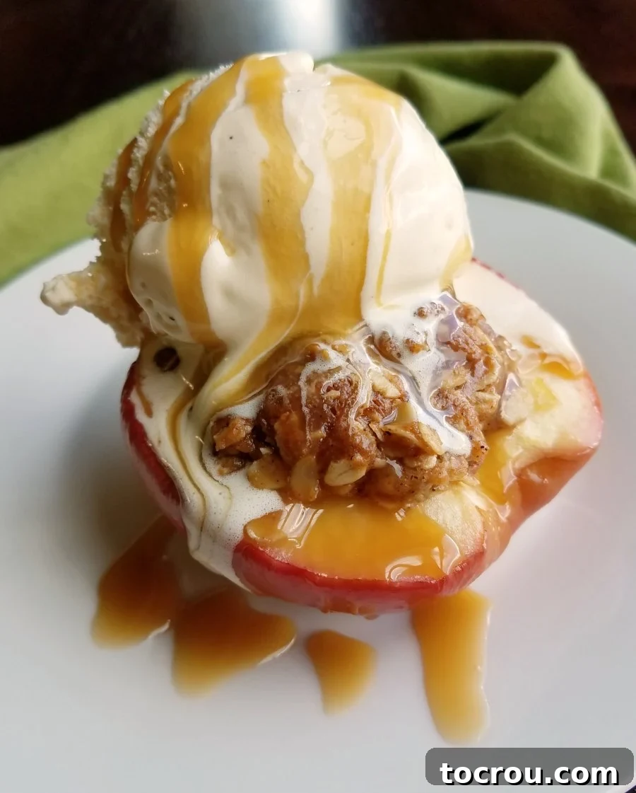 Baked apple half with brown sugar and oat filling, topped with vanilla ice cream and a luscious drizzle of caramel sauce.