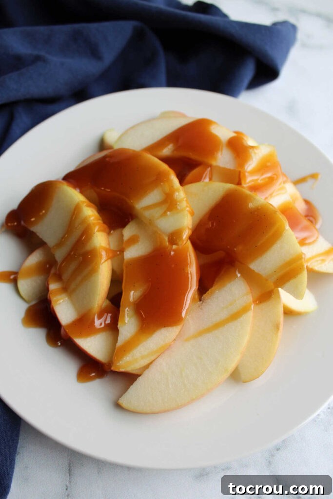 Warm dulce de leche drizzled over fresh apple slices.