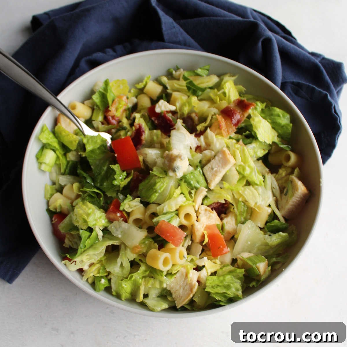 Chicago Chopped Salad Classic 2 Bowl of Portillo's style chopped salad with lettuce, pasta, bacon, tomatoes, chicken, cheese and more.