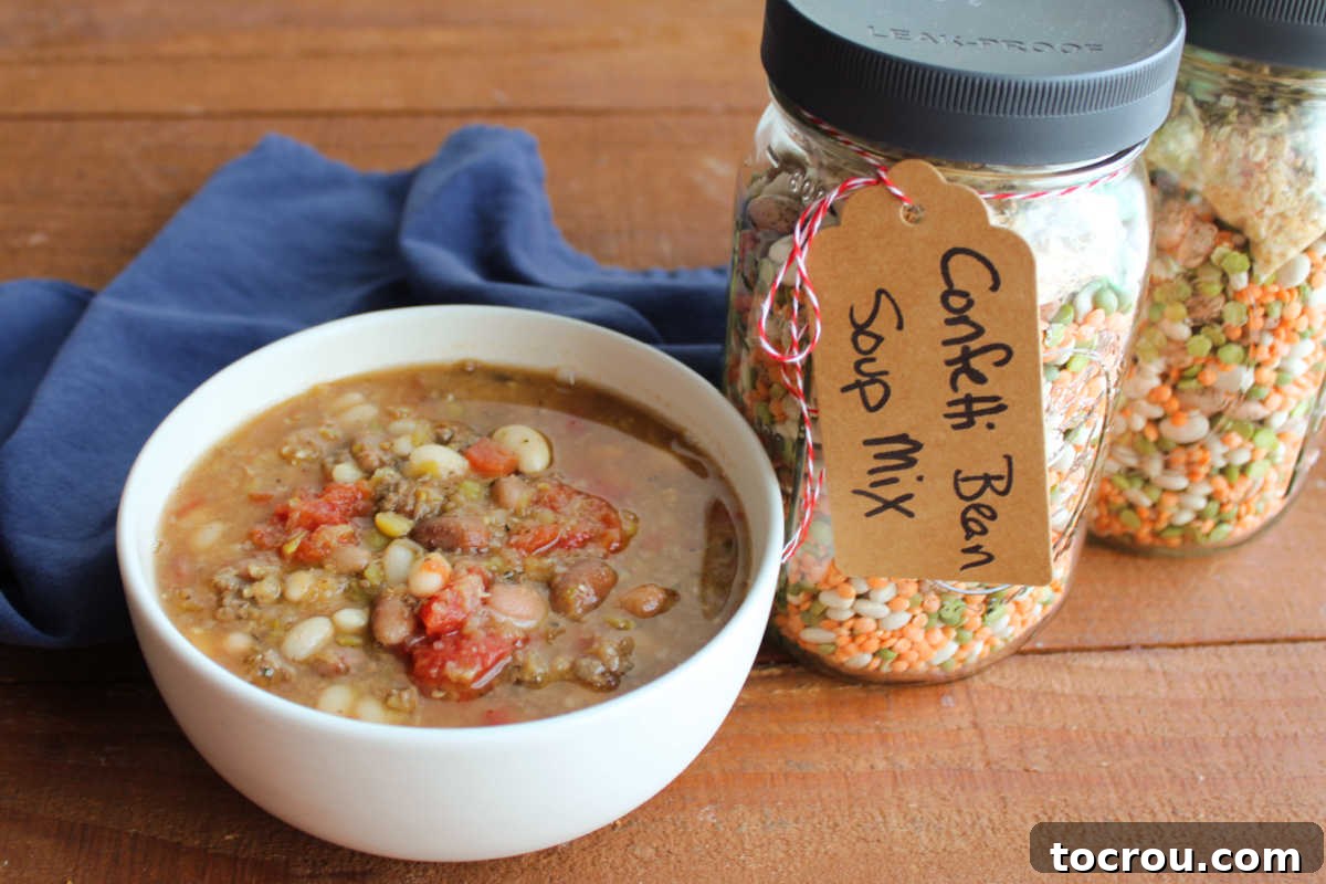 Bowl of confetti bean soup next to jars of the mix it was made from.