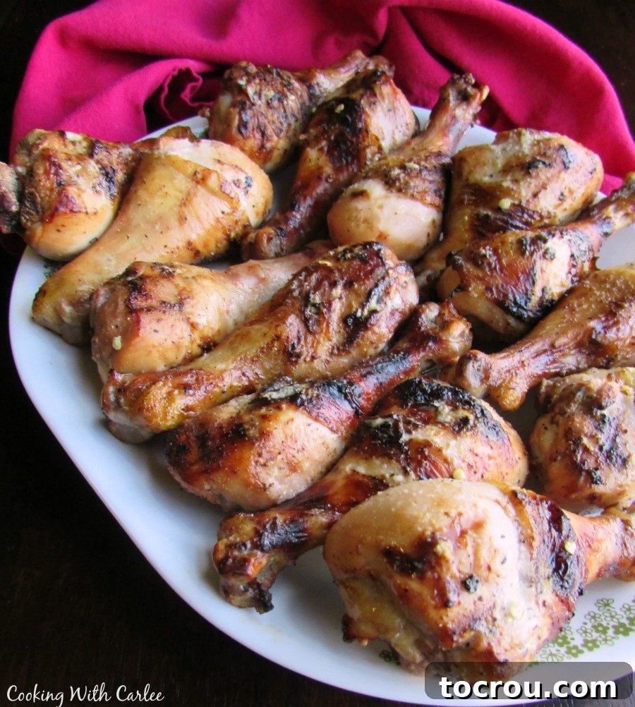 Platter of Grilled Tequila Lime Chicken Drumsticks A platter of beautifully grilled tequila lime chicken drumsticks, garnished and ready to be served.