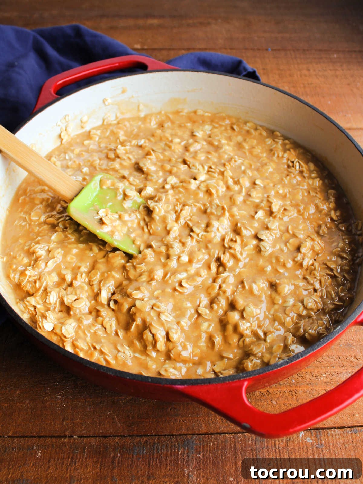 The perfectly blended peanut butter no-bake cookie mixture resting in the pan, ready to be scooped into individual cookies.