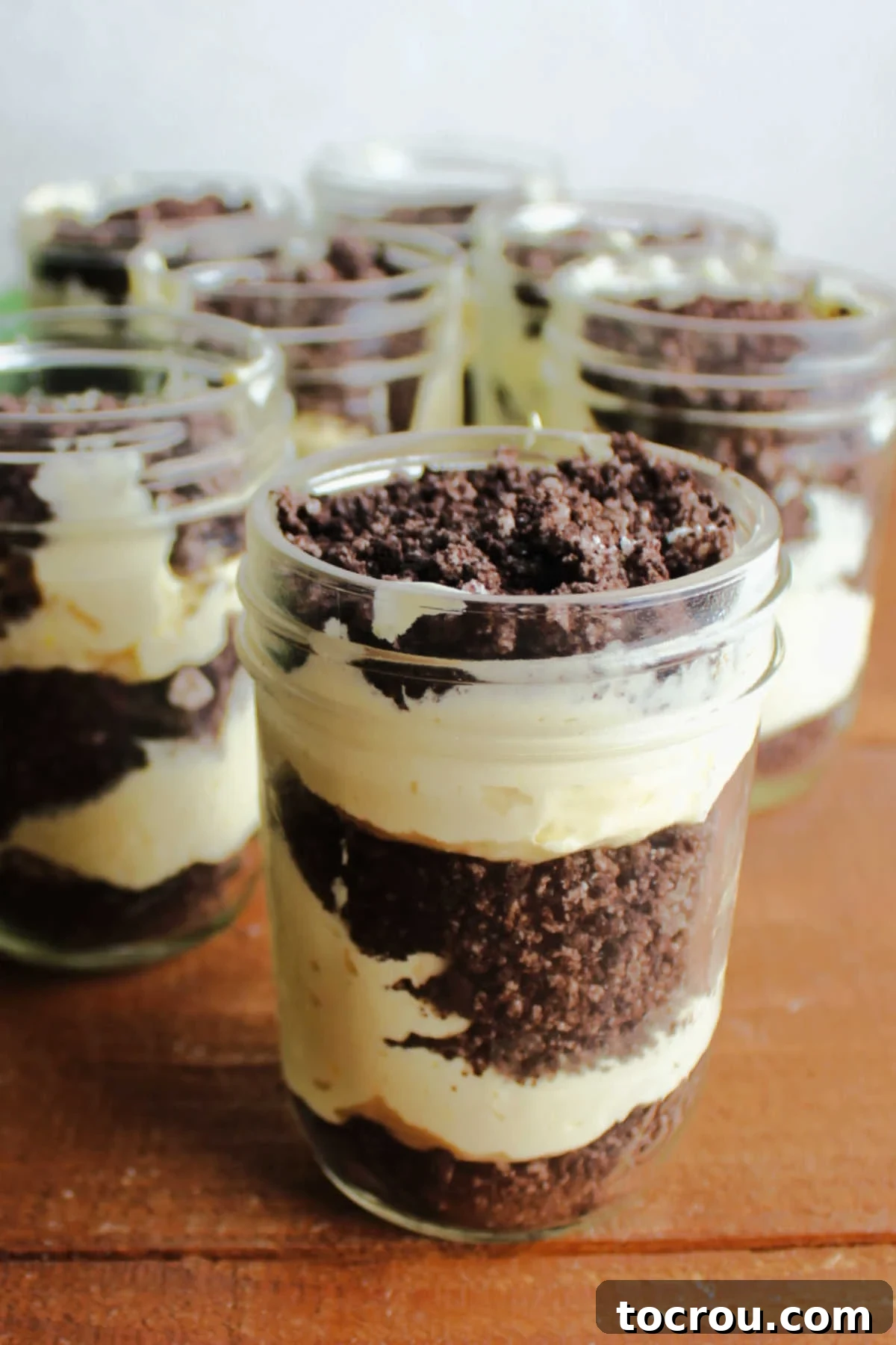 Layered Dirt Pudding in Jars Layers of vanilla pudding and Oreo crumbs in jars for individual sized dirt puddings.