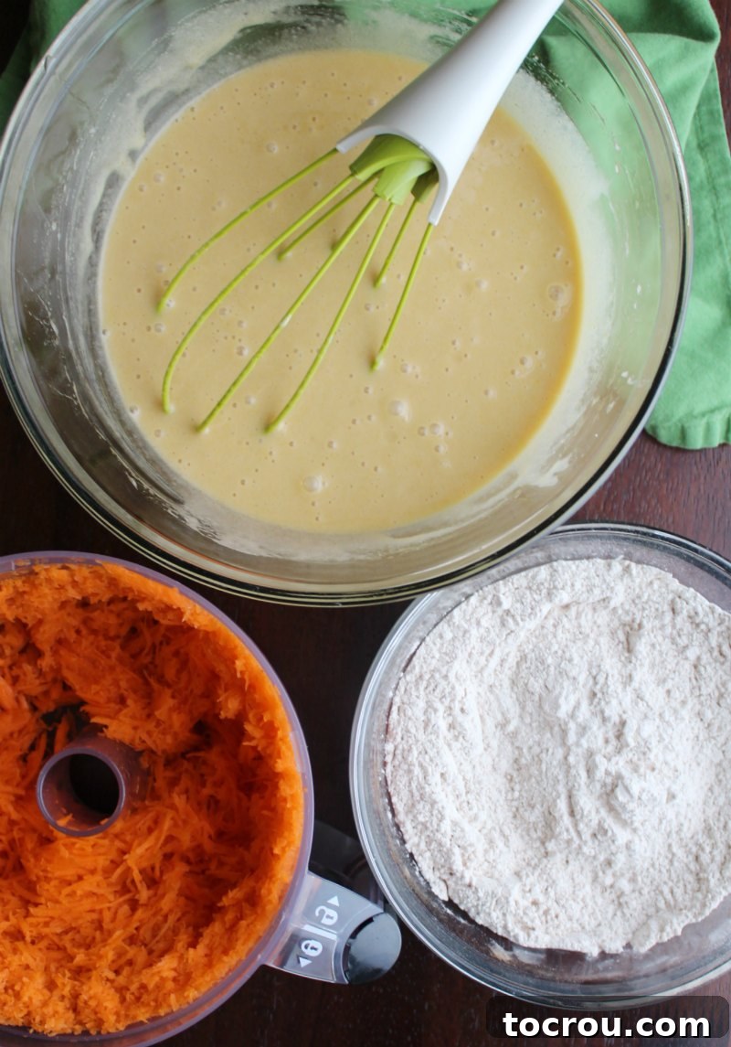 Irresistible Homemade Carrot Cake 4 bowls of wet and dry ingredients for carrot cake and food processor with shredded carrots.