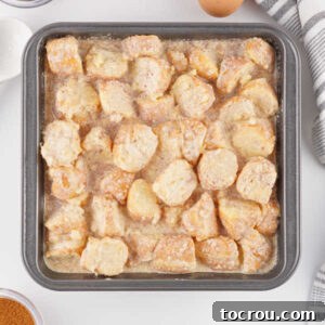 Pan of donut bread pudding ready to go in the oven to bake.