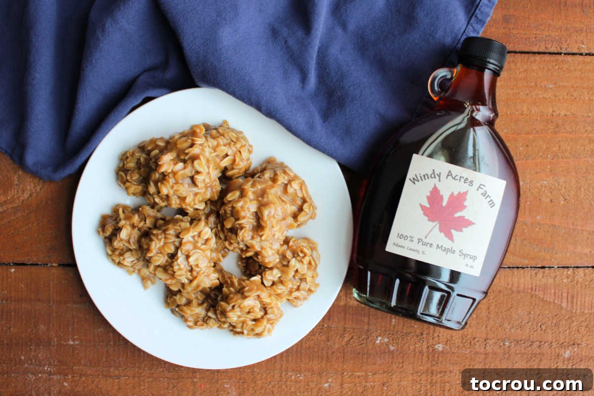 Easy Maple No-Bake Treats 4 Plate of no bake cookies with maple syrup and oatmeal ready to eat next to a jar of pure maple syrup.