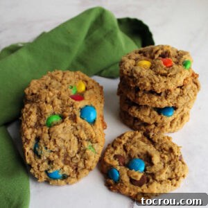 A Stack of Perfectly Baked Monster Cookies Stack of peanut butter monster cookies with oatmeal, chocolate chips and m&ms.