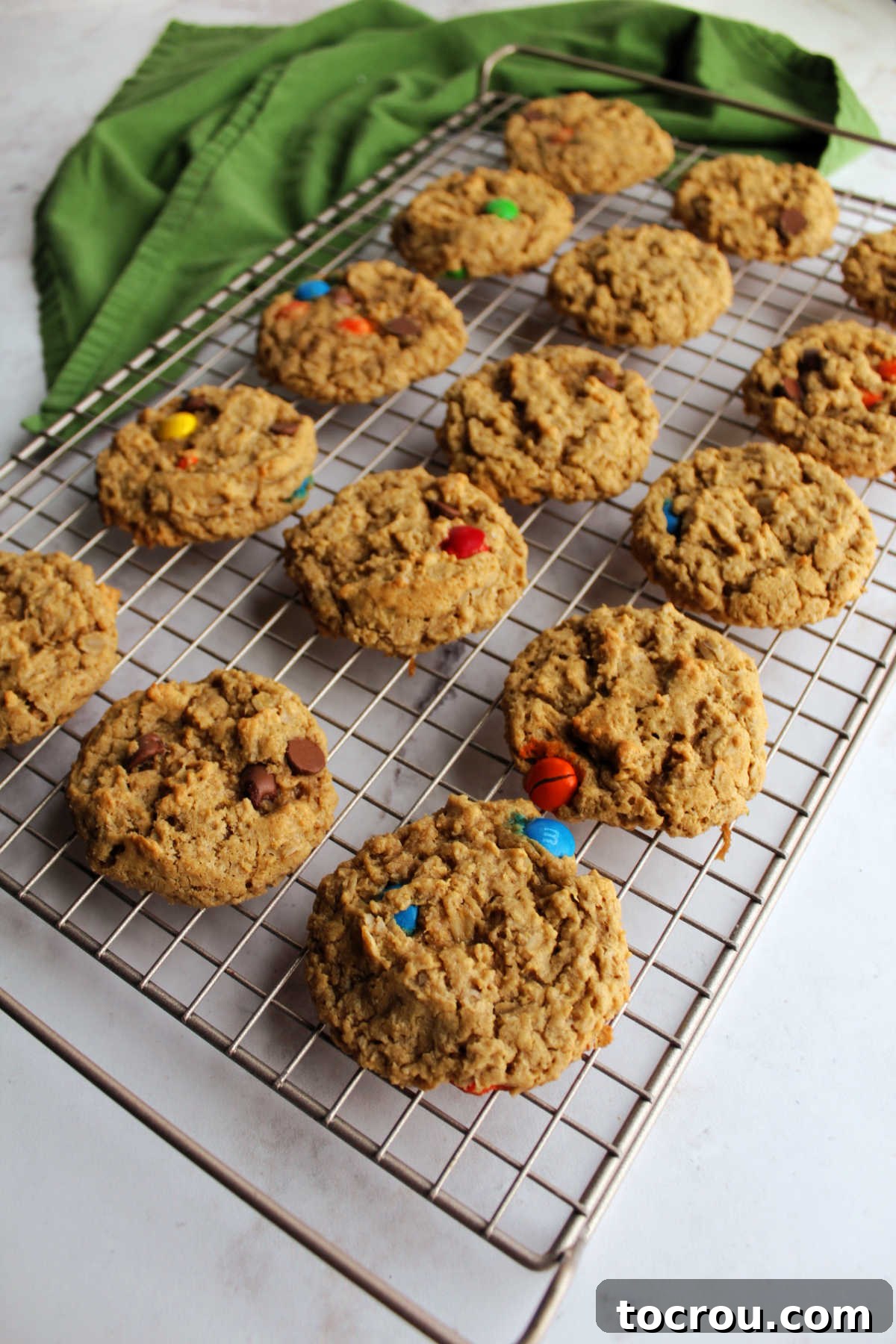 Cooling Peanut Butter Oatmeal Cookies Peanut butter oatmeal monster cookies cooling on wire rack.