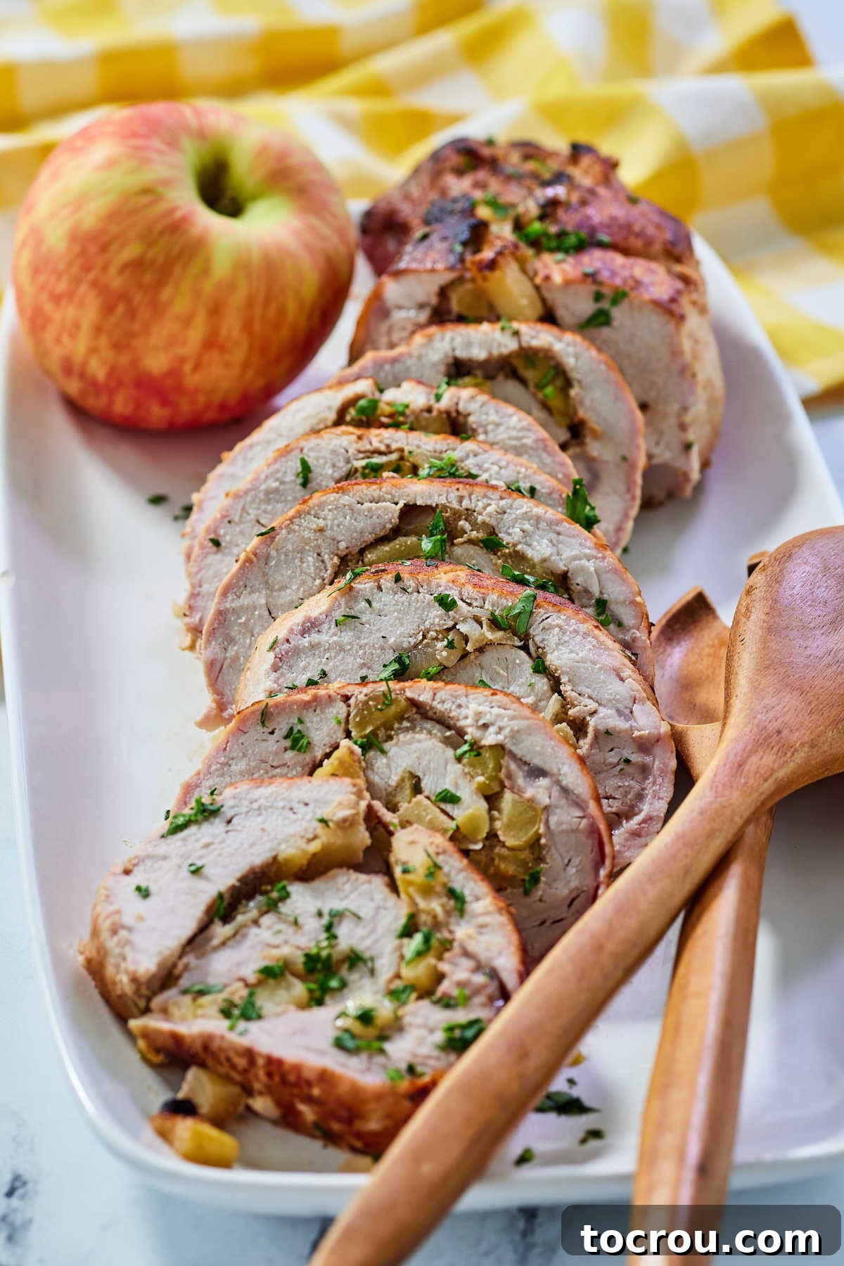 Platter of Apple Stuffed Pork Loin Platter of pork loin stuffed with apples on platter, ready to eat.