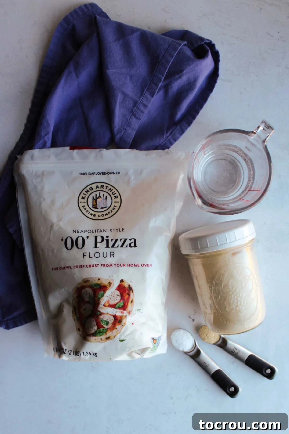 Sourdough Pizza Crust Ingredients Ingredients: 00 flour, sourdough starter, water, salt and yeast ready to be made into pizza dough.