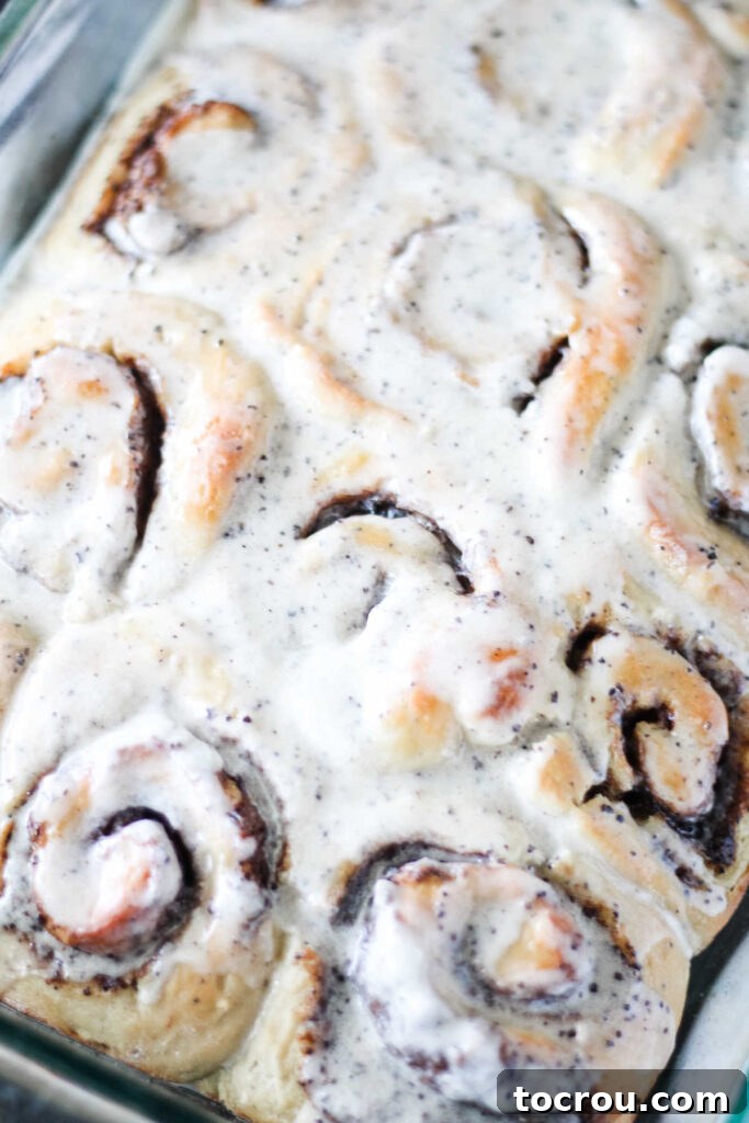 Coffee Cinnamon Rolls with Icing Pan of coffee cinnamon rolls with white icing on top.